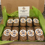 Box of bread with 'Hobbs Bakes' branding on a green tissue paper background